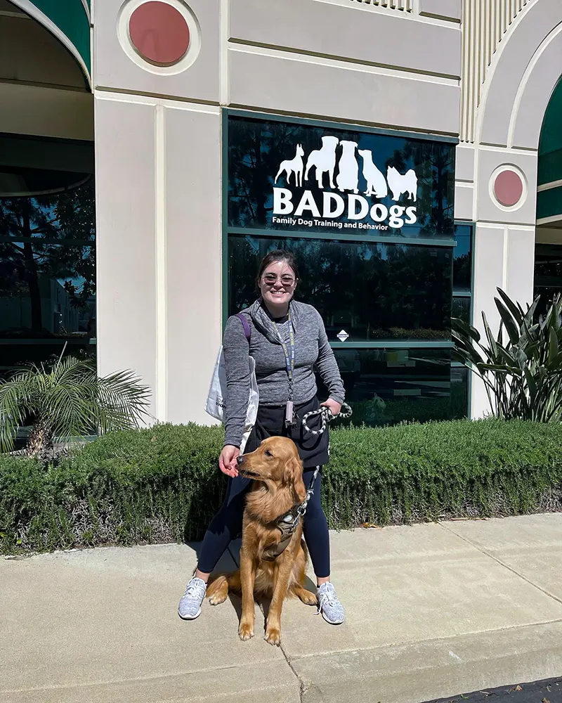 Dog and owner in front of BADDogs Office